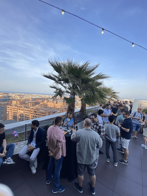 group of people attending a rooftop happy hour